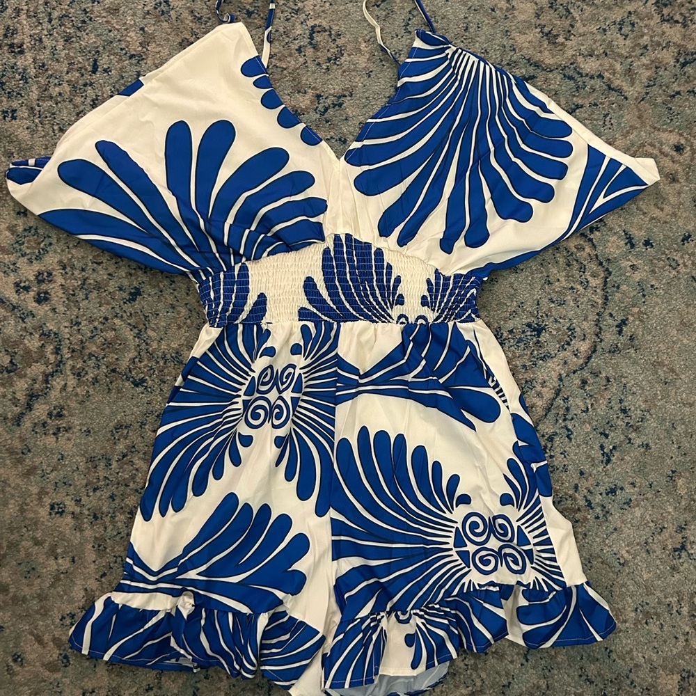 Blue and White Tropical Jumpsuit with Bold Patterns